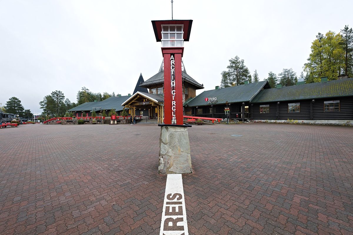 The Arctic Circle line painted across the village square